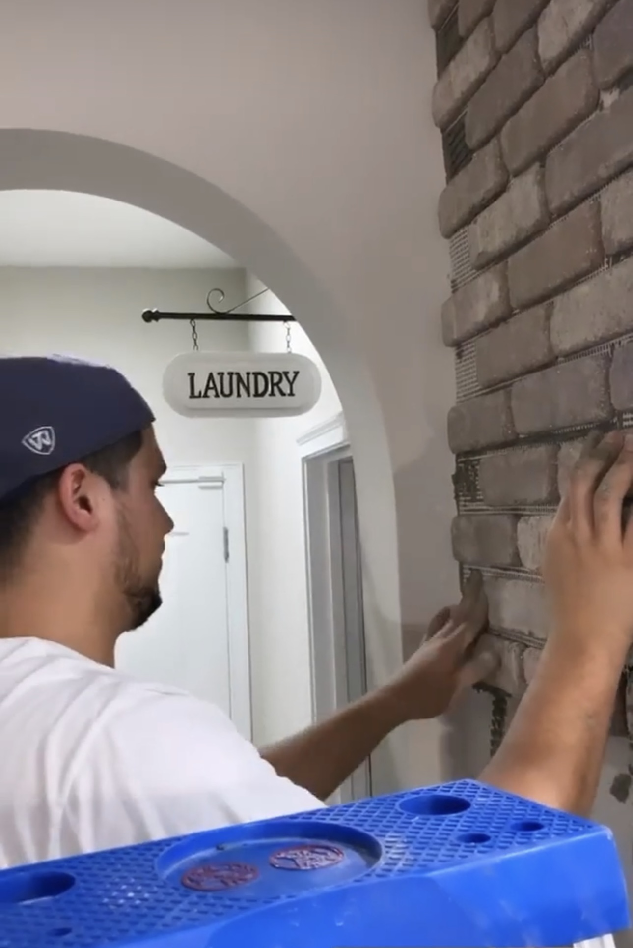 how to put wallpaper on brick wall